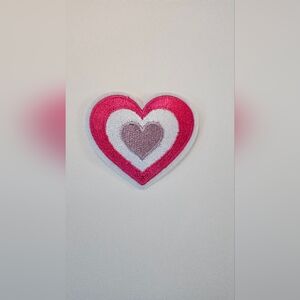 Heart embroidered iron on patch.